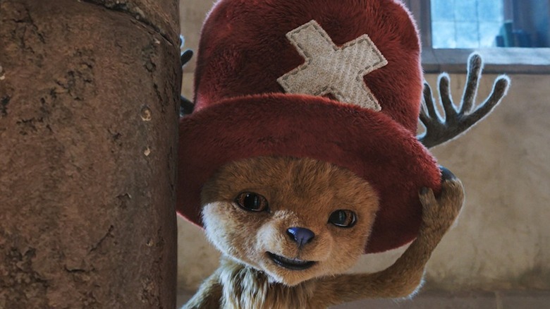 Tony Tony Chopper touching their hat in One Piece season 2