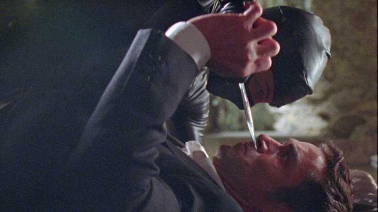 Serpentik tries to stab John Diman with a knife in Reflection in a Dead Diamond