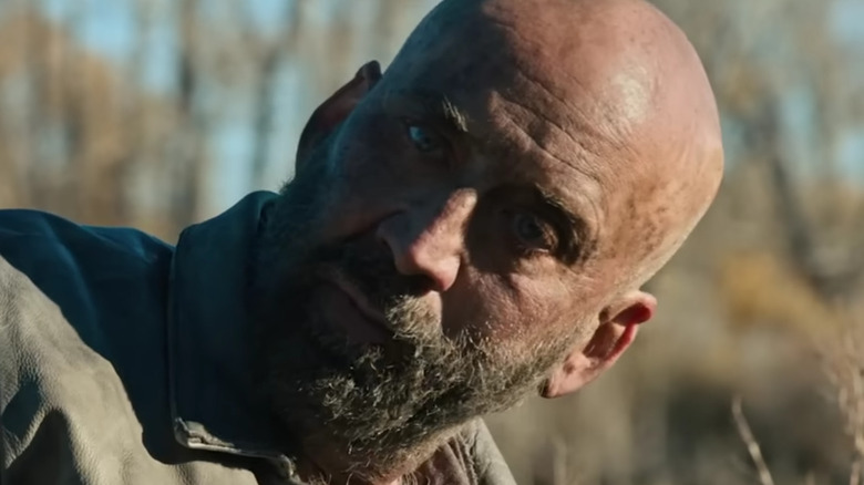 Nicolas Cage's Miller with bald head and bushy beard in Butcher's Crossing