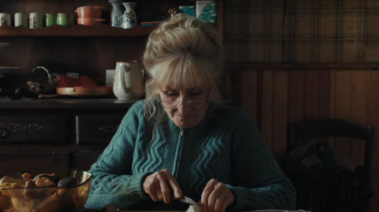 Hélène Vincent's Michelle Giraud cutting mushrooms with a knife in When Fall Is Coming