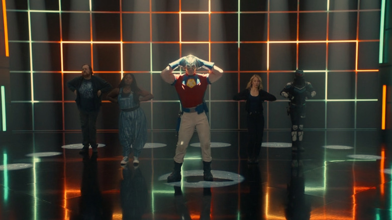 Steve Agee as John Economos, Danielle Brooks as Leota Adebayo, John Cena as Chris Smith, Jennifer Holland as Emilia Harcourt, and Freddie Stroma as Vigilante dancing in the opening for season 2 of Peacemaker