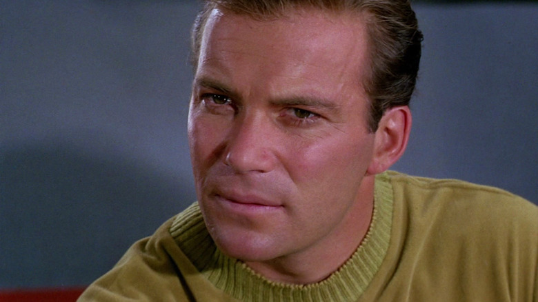 William Shatner as Kirk looking concerned in Star Trek: The Original Series