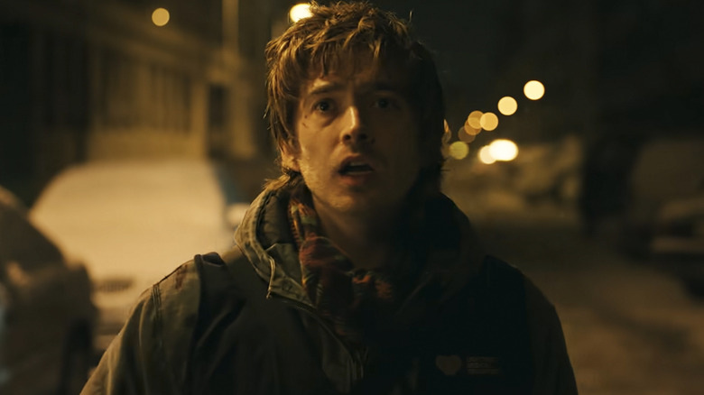 Bryan standing outside in the snow in Resident Evil