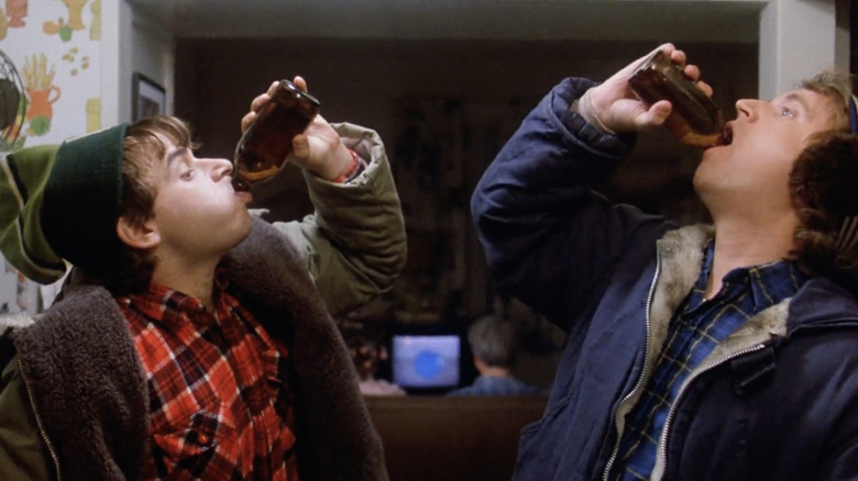 Rick Moranis as Bob McKenzie and Dave Thomas as Doug McKenzie knock back beers in Strange Brew