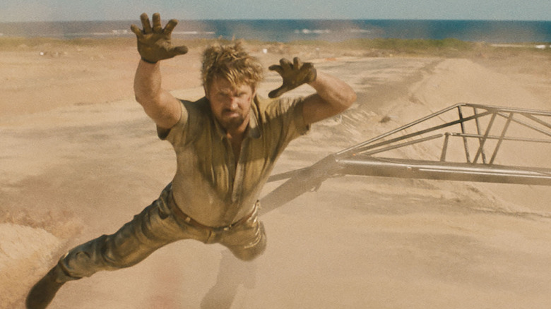 Colt flying through the air with his hands outstretched in The Fall Guy