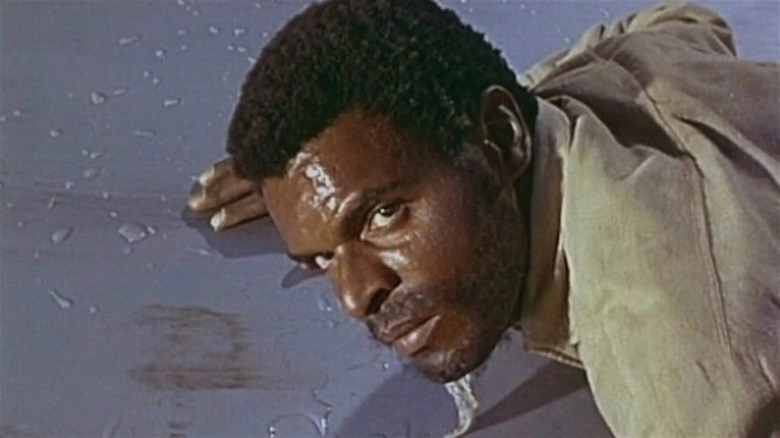 Otis Young's Jemal David is seen in closeup in The Outcasts