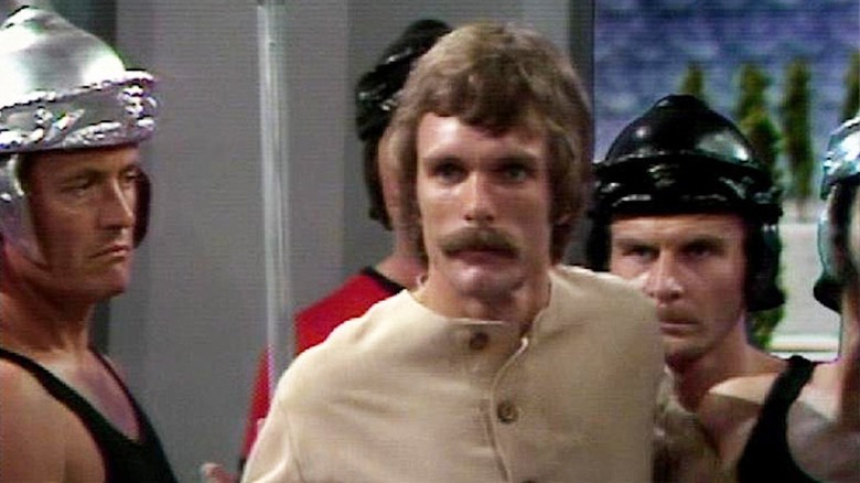 Keir Dullea as Devon is held prisoner by helmeted goons in The Starlost
