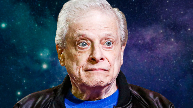 Harlon Ellison looking alert against the backdrop of the galaxy