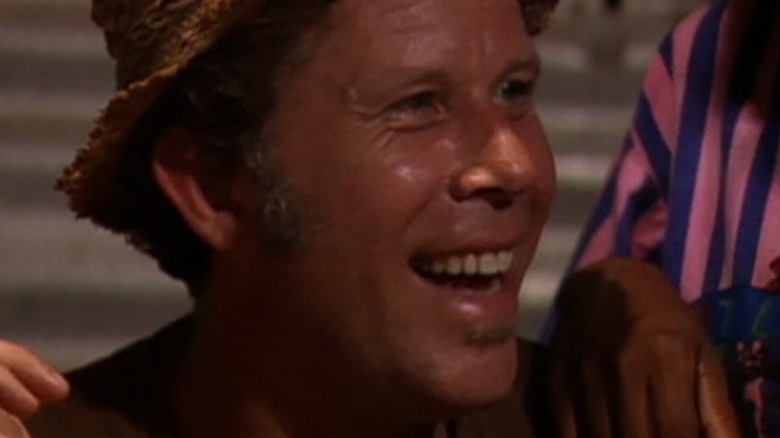 Tom Waits smiling in Fishing with John