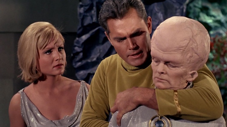Vina looks on as Captain Pike chokes out a Talosian on Star Trek