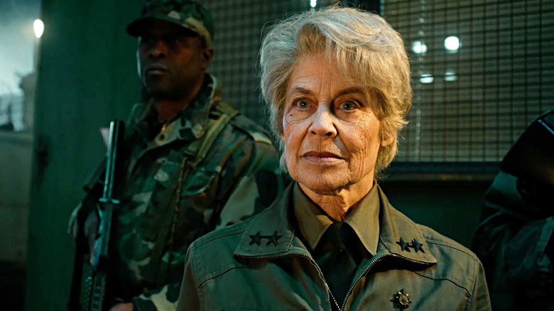 Linda Hamilton's Dr Kay stands alongside soldiers in Stranger Things