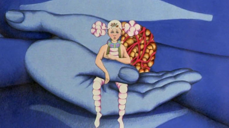 A small Om in weird clothes in giant Draag hands in Fantastic Planet
