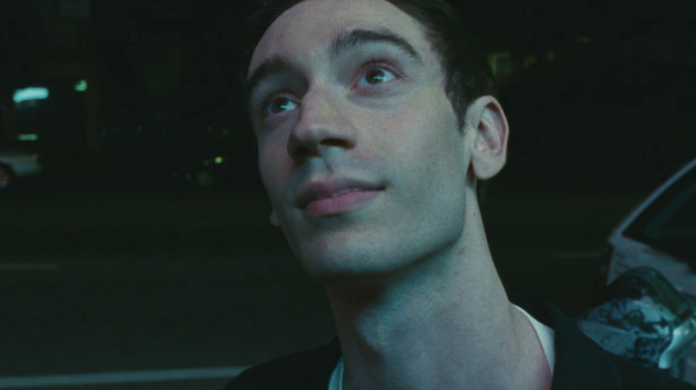 Théodore Pellerin's Matthew Morning looks looks up as he stands on a street in Lurker