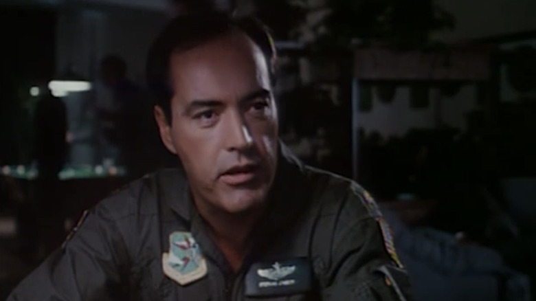 Powers Boothe's Major Cassidy sits in a canteen in By Dawn's Early Light