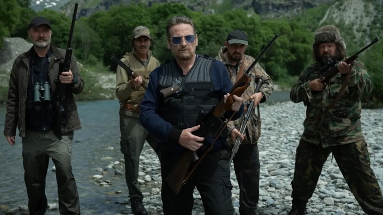 Benoît Magimel as Franck and four of his hunting buddies are locked and loaded in The Hunt