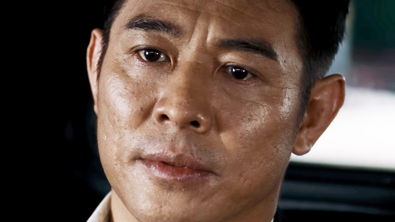 Jet Li's Yin Yang is seen in closeup as he sits in a car in The Expendables