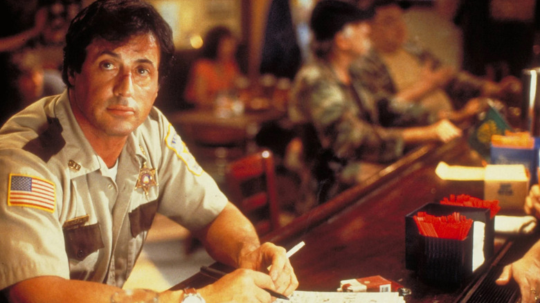 Freddy at the bar smoking a cig in Cop Land