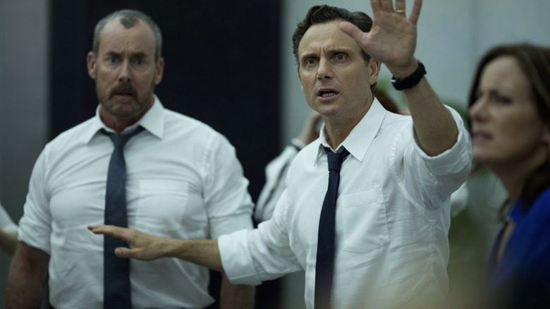 John C. McGinley as Wendell and Tony Goldwyn as Barry wearing white shirts in The Belko Experiment