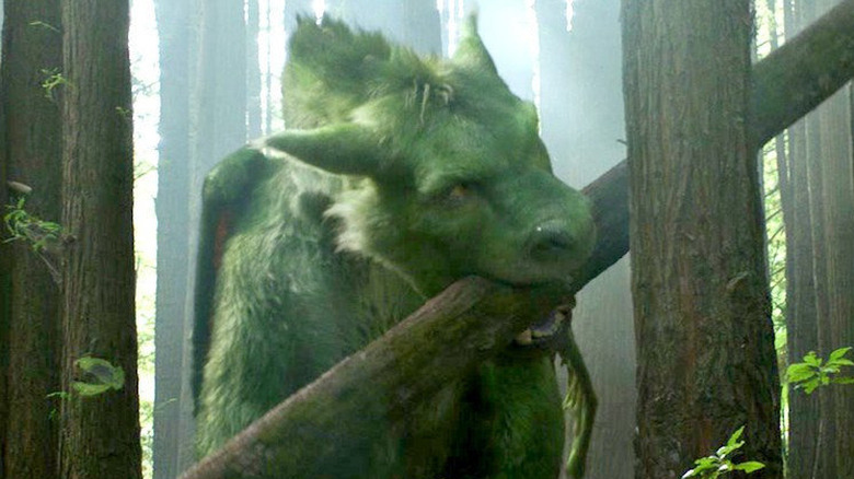 Elliot bites on a tree trunk in "Pete's Dragon"