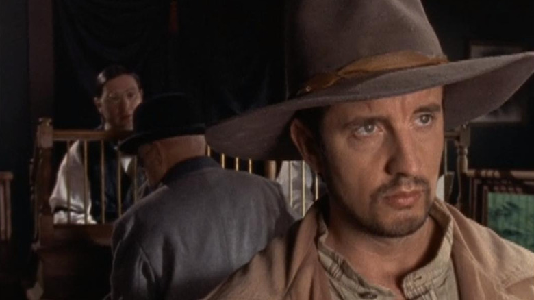 Grant Shaud as a criminal wearing a cowboy hat in Dead Man's Gun