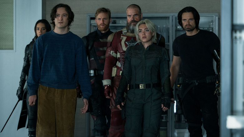 Hannah John-Kamen as Ghost, Lewis Pullman as Bob, Wyatt Russell as John Walker, David Harbour as Red Guardian, Florence Pugh as Yelena Belova, and Sebastian Stan as Bucky Barnes all standing together in a lab in Thunderbolts