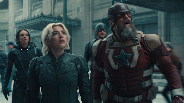 Hana John-Camin in the role of the ghost, Florence Bug in the role of Yelena Bellova, White Russell in the role of John Walker, and David Harbor as a Reed goalkeeper staring at something in the sky in Thunderbolts
