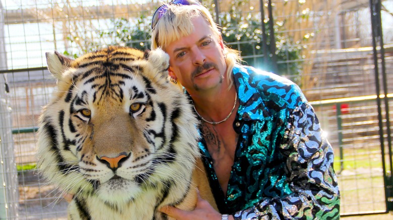 Joe Exotic poses with a tiger in the documentary Tiger King