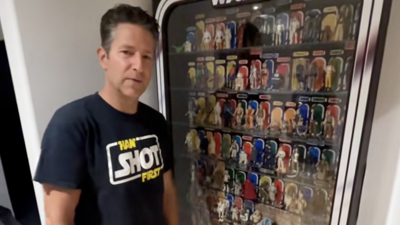 Mr. Doherty with his wall of vintage Star Wars figures