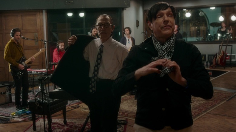 Russell and Ron Mael of Sparks exiting a music studio in the movie Annette