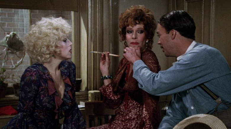 Bernadette Peters, Carol Burnett, and Tim Curry in Annie
