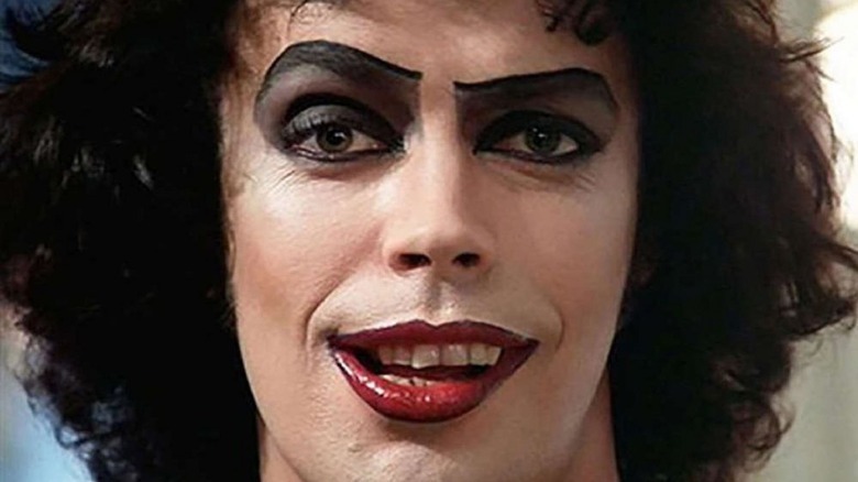 Tim Curry as Dr. Frank-N-Furter wearing heavy makeup in The Rocky Horror Picture Show