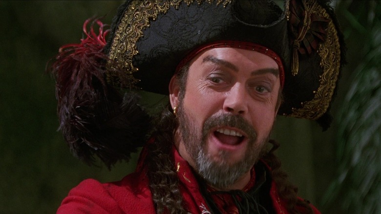 Tim Curry as Long John Silver smiling in Muppet Treasure Island