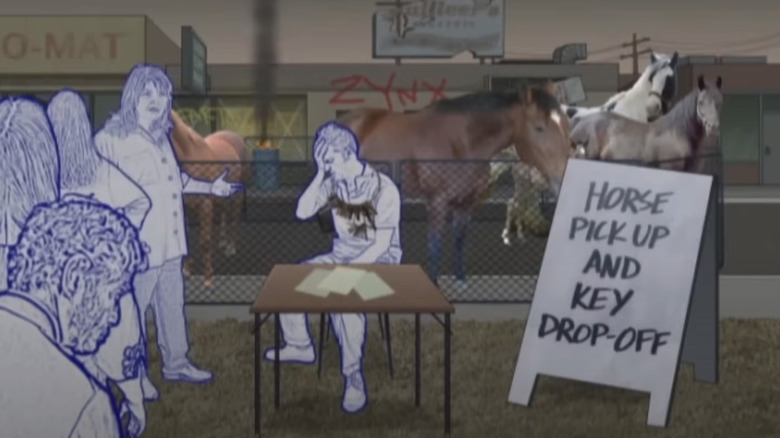 Tim Heidecker sits at a desk next to a pen with horses in Tom Goes to the Mayor