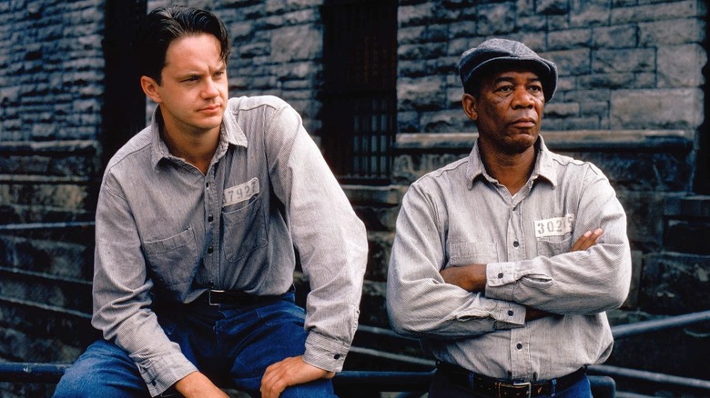 Tim Robbins Morgan Freeman sitting on railing The Shawshank Redemption