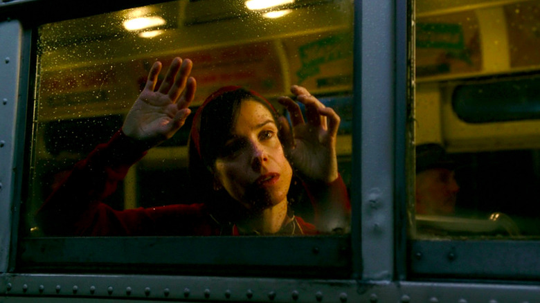 Sally Hawkins looks out a rain-soaked window in The Shape of Water
