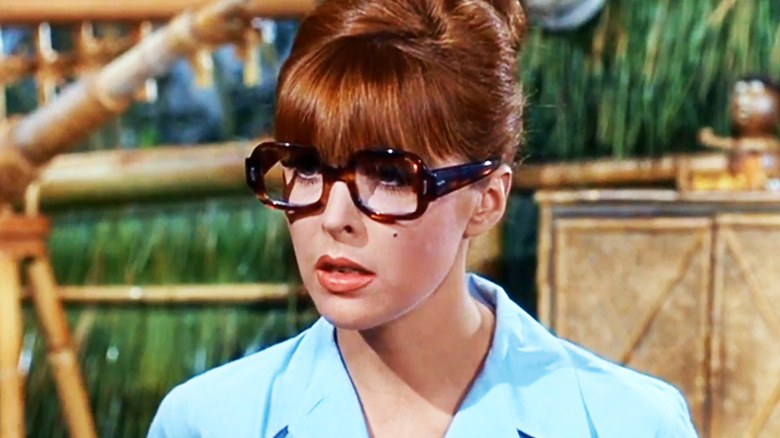 Tina Louise's Ginger Grant is seen in closeup wearing glasses in Gilligan's Island.jpg