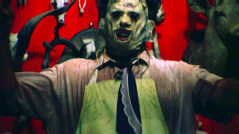 Leatherface appears in the doorway in The Texas Chain Saw Massacre