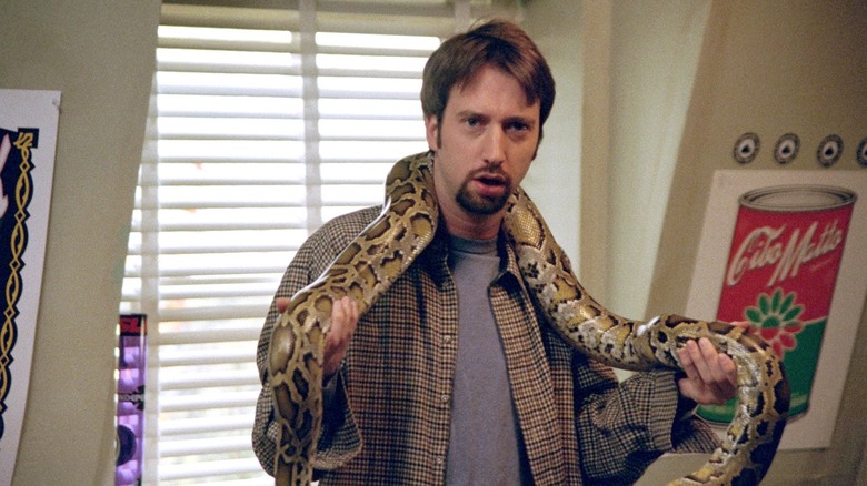 Tom Green as Barry holding a snake in Road Trip