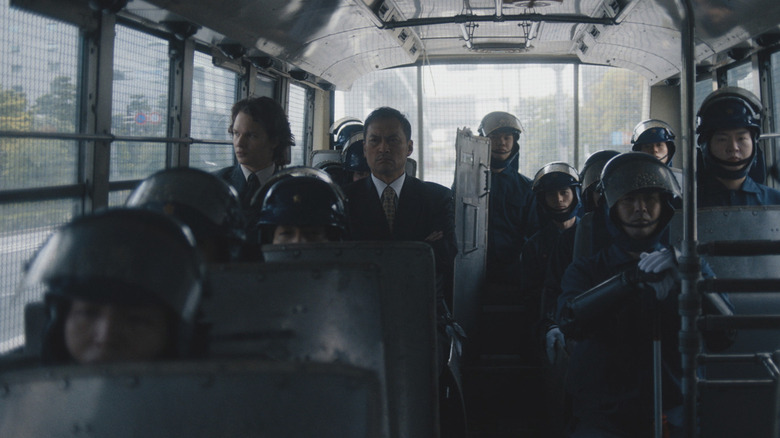 Ansel Elgort and Ken Watanabe in Tokyo Vice police vehicle