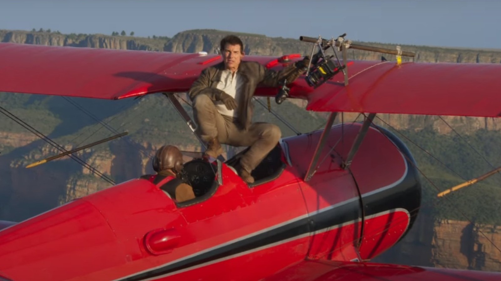 tom cruise holding on to plane