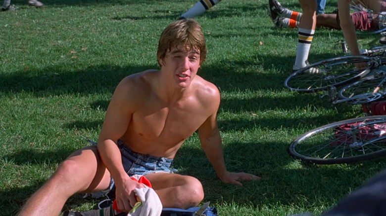 Tom Cruise wearing nothing but jeans shorts and a punch drunk expression as Billy in Endless Love