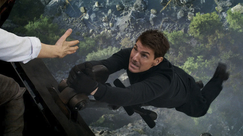 Tom Cruise hanging in Mission: Impossible Dead Reckoning Part One
