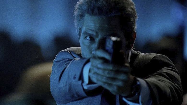 Tom Cruise brandishes a handgun as Vincent in Collateral