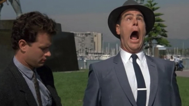 Dan Aykroyd as Sgt. Joe Friday yelps and crosses his eyes in Dragnet