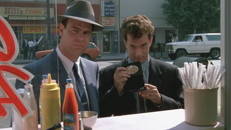Dan Aykroyd as Sgt. Joe Friday and Tom Hanks as Detective Pep Streebek investigate a cult in Dragnet
