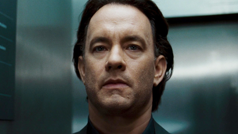 Tom Hank as Robert Langdon looking worried in an elevator in The Da Vinci Code
