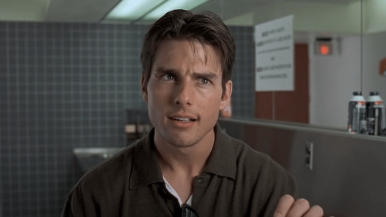 Tom Cruise has an intense conversation in a restroom as Jerry Maguire