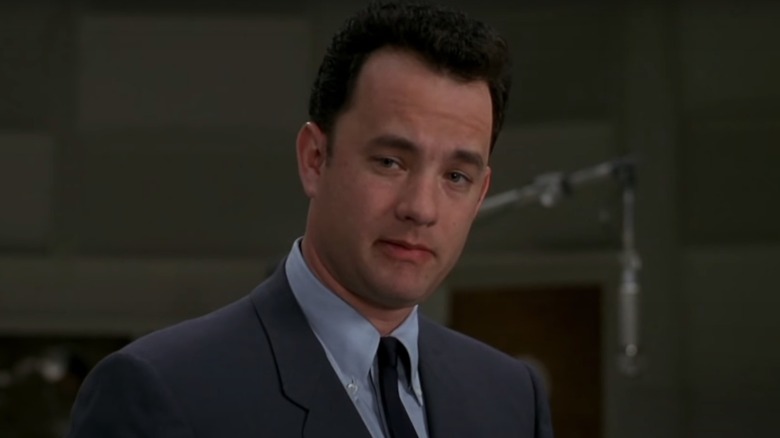 Tom Hanks looks sharp in a suit as music manager Amos White in That Thing You Do