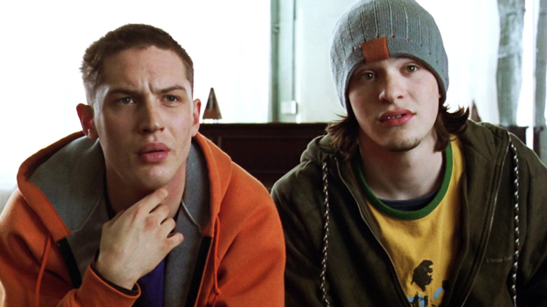 Tom Hardy's Tom sits alongside Charlie Cox's Theo in Dot the I