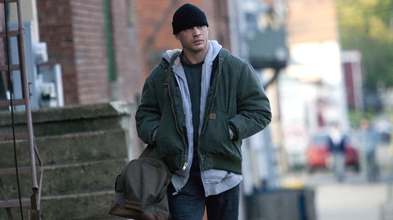 Tom Hardy as Tommy walking down a street in Warrior